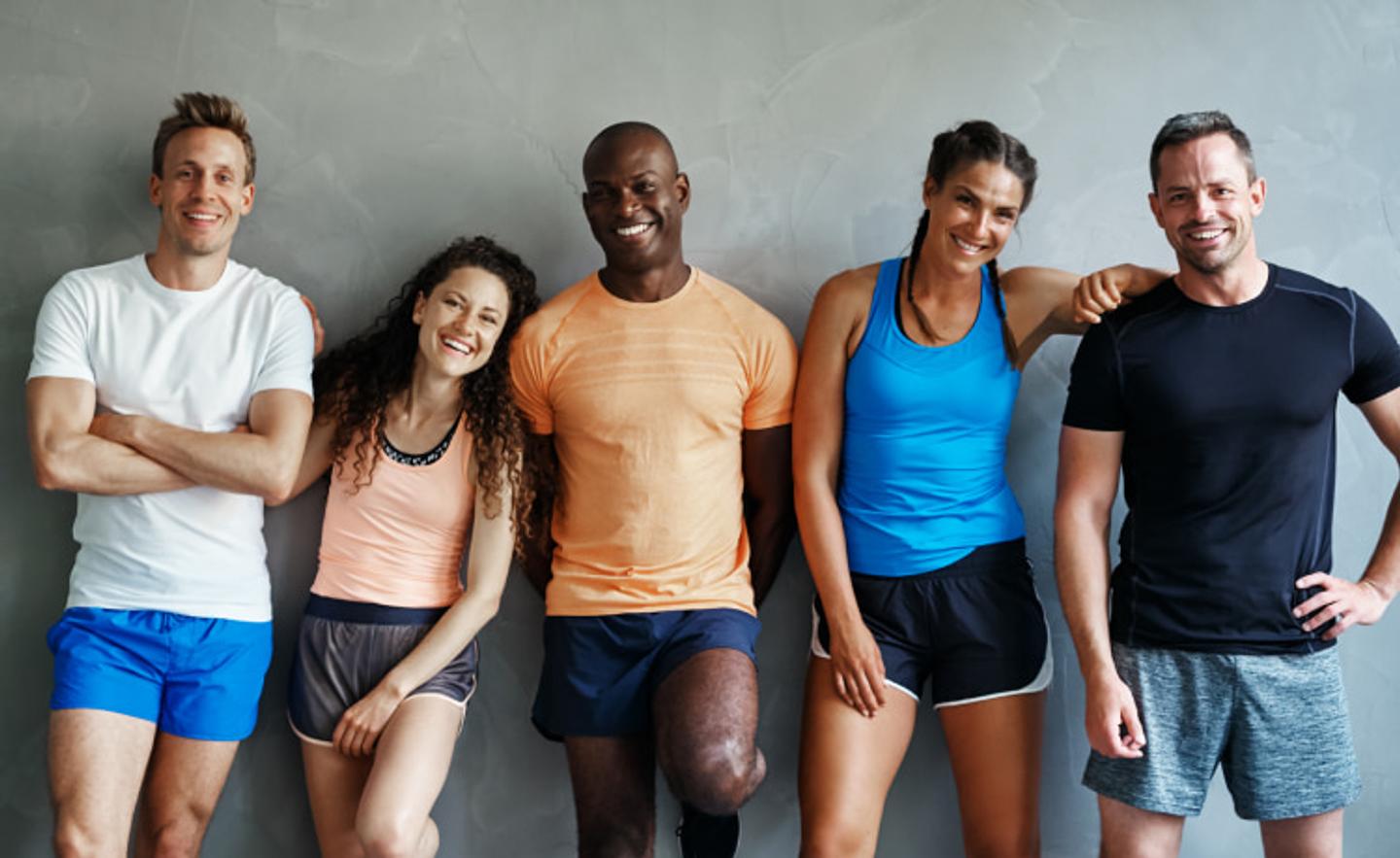 Group of Fitness Coaches and Personal Trainers Smiling for a Photo